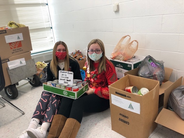 students with canned goods